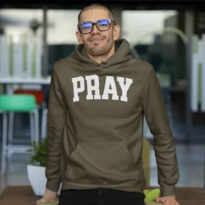 Man wearing olive green Pray Christian Hoodie with bold PRAY design