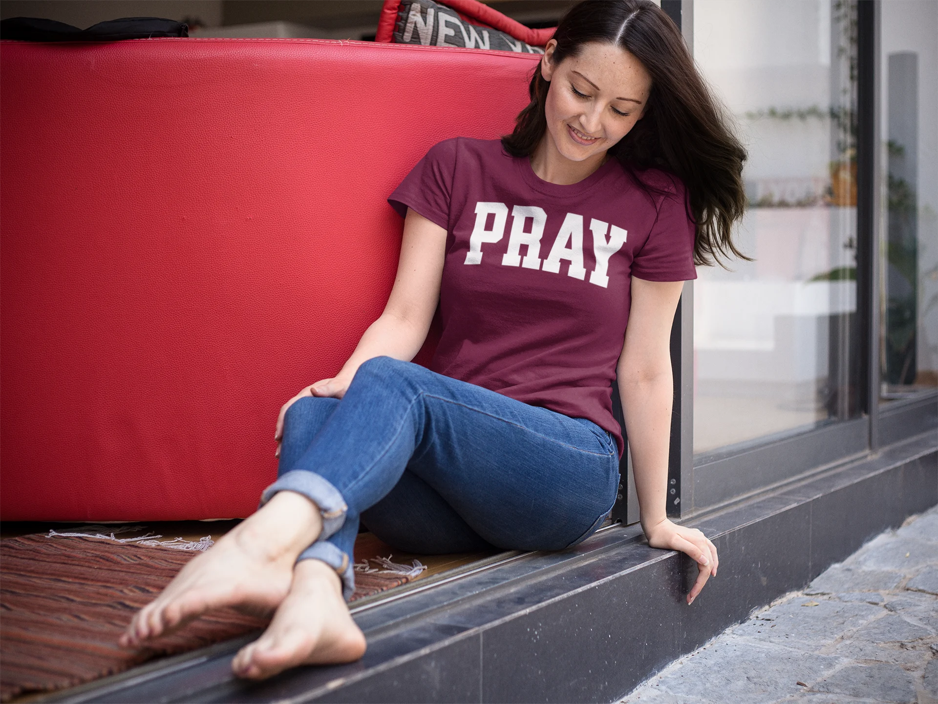 Woman wearing a Pray Christian T-Shirt with bold PRAY design