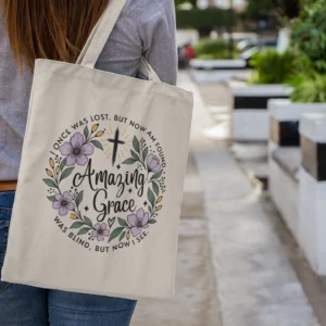 Amazing Grace Christian Tote Bag with floral cross design and faith message